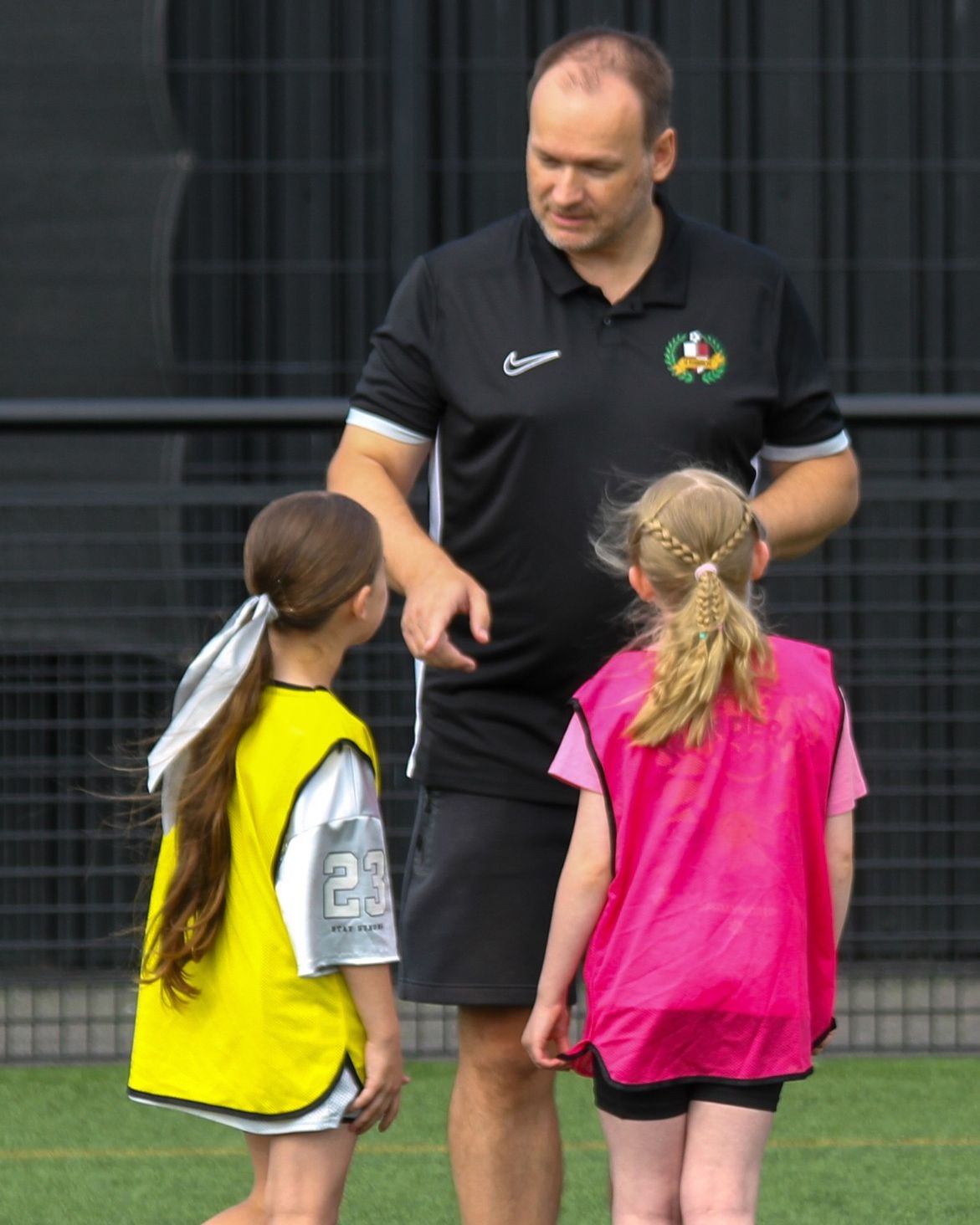 One Admin's founder coaching two young players at training
